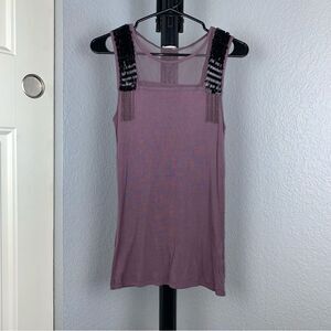 Calliope size small women’s tank top with edgy details.